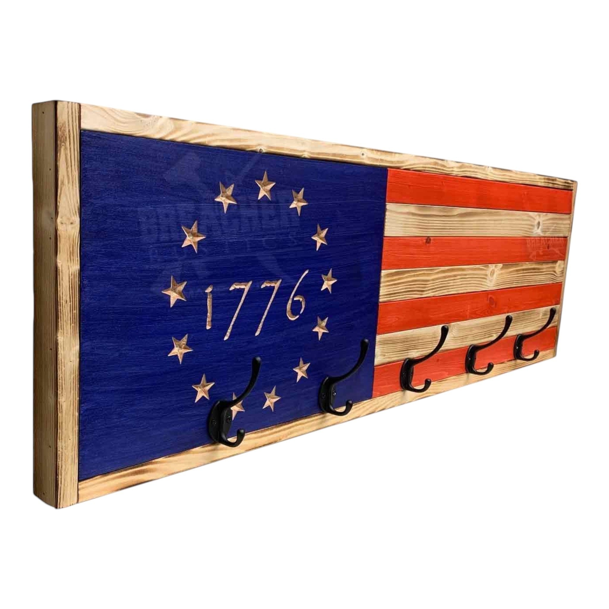 Breacher Rustics 1776 Betsy Ross American flag coat rack with 5 black hooks. Wood construction with blue union and red stripes. betsy ross 1776 flag coat rack american wooden wall hooks patriotic historical usa flag entryway storage rack