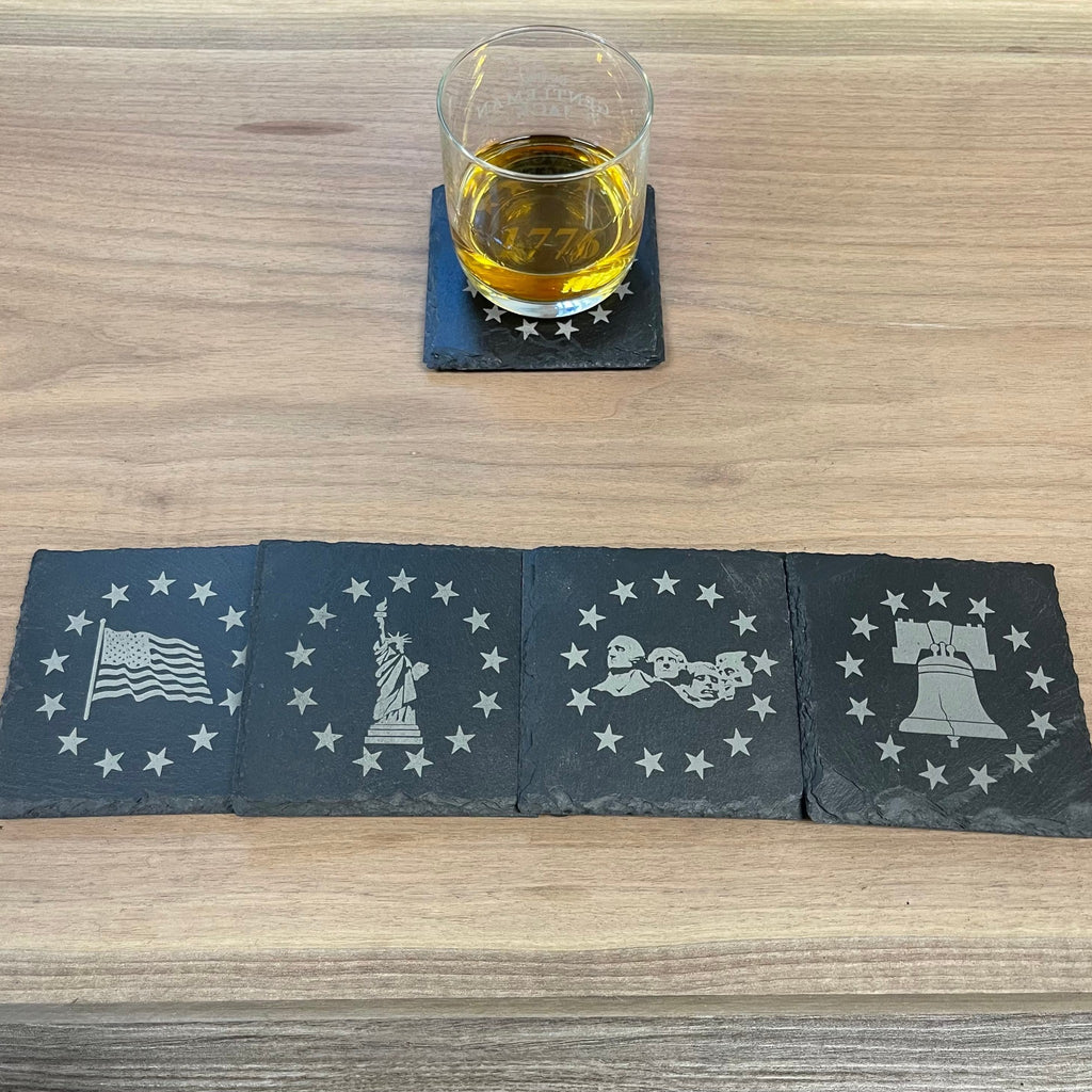 Breacher Rustics Patriot Pack B slate coasters featuring USA flag, Statue of Liberty, Mt. Rushmore, and Liberty Bell designs. patriotic coaster set man cave slate set of 8 engraved square coasters for bar table rustic usa themed gift