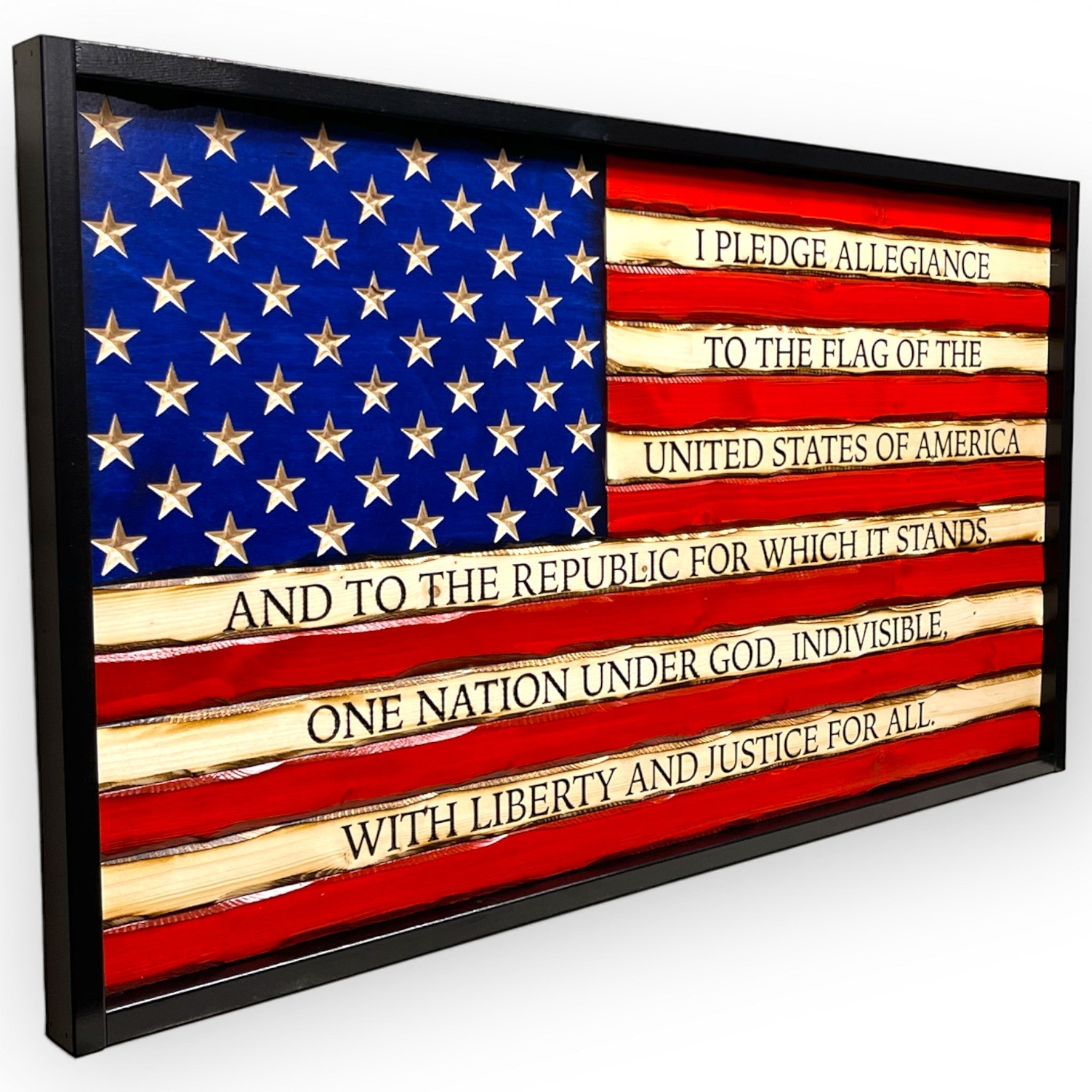 Breacher Rustics battle worn carved wood American flag with Pledge of Allegiance text and carved stars, black frame. battle worn pledge of allegiance carved wood flag handmade american flag wall art patriotic rustic decor usa made