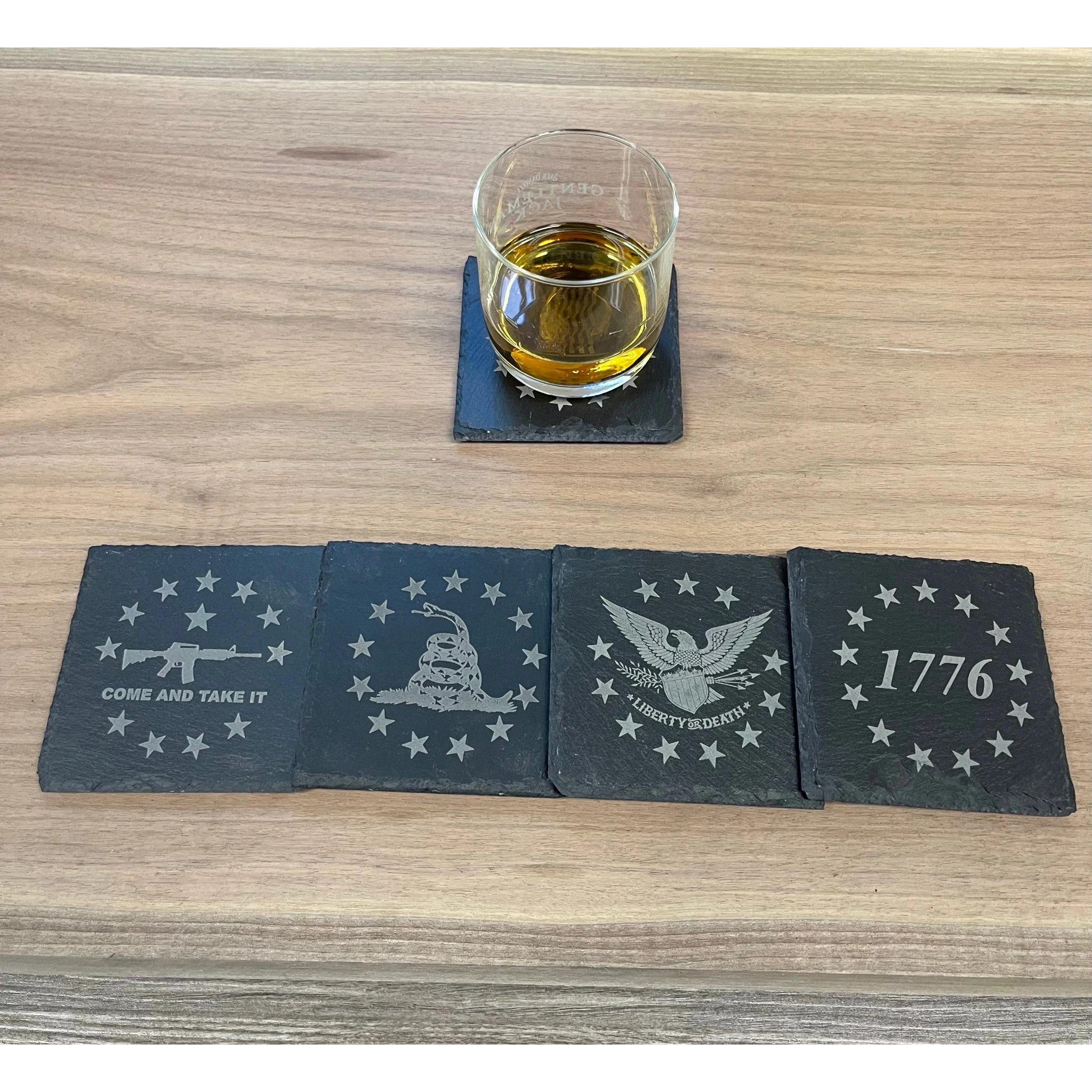 Breacher Rustics "Patriot Pack A" set of 4 charcoal gray square slate coasters with patriotic engravings: "Come and Take It" rifle, Gadsden flag snake, eagle with "Liberty or Death", and "1776".patriot pack square slate coasters set of 8 patriotic engraved american flag themed drink coasters rustic home decor usa made
