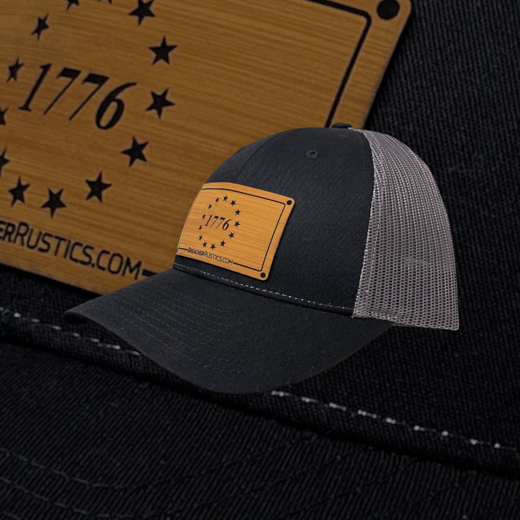 Breacher Rustics black trucker hat with Betsy Ross 1776 patch, cotton/nylon/polyester blend, adjustable snapback.