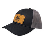 Breacher Rustics black cotton and mesh trucker hat with a bamboo leather patch and adjustable snapback.