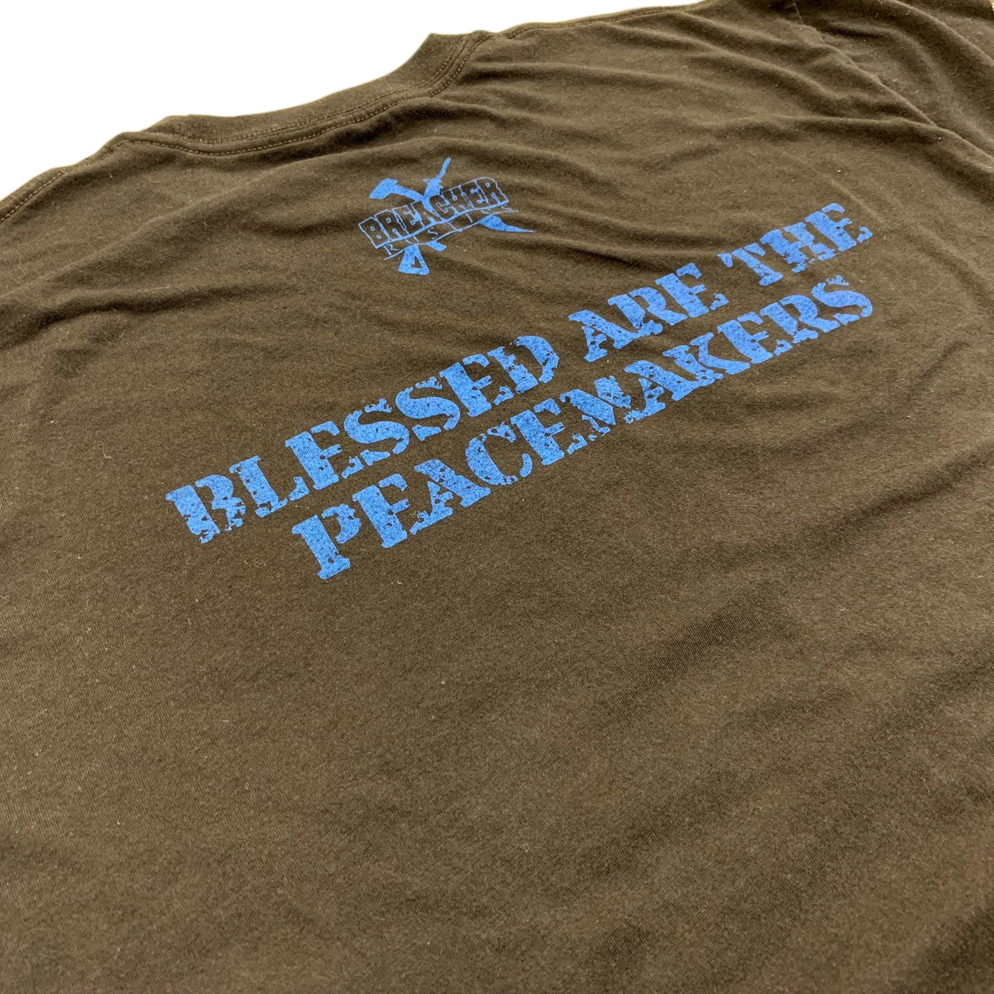 Breacher Rustics brown cotton t-shirt with blue distressed text "Blessed Are The Peacemakers" and logo.
