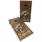 Breacher Rustics custom dark wood cornhole set with white established date and floral initial design.