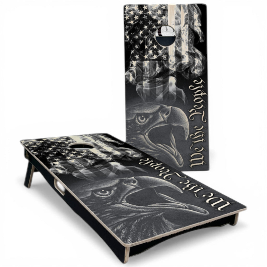Breacher Rustics patriotic cornhole set with eagle, American flag, and "We the People" text. Natural colors. we the people cornhole set natural colors handmade wooden patriotic backyard bean bag toss game usa flag boards