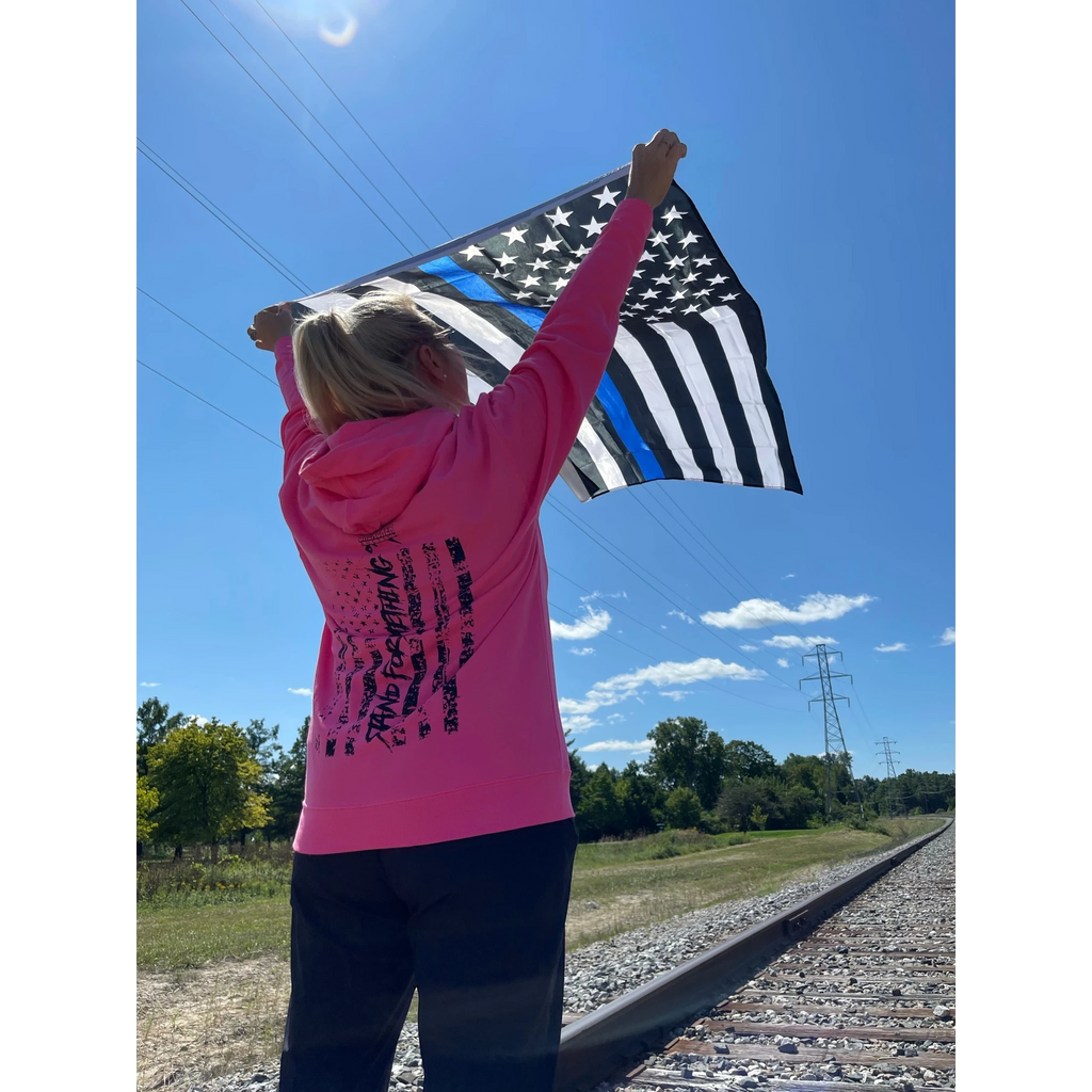 Breacher Rustics pink cotton blend pullover hoodie with a two-piece hood and front muff pocket, featuring a distressed flag graphic. womens pink patriotic breacher hoodie soft fleece casual streetwear style usa made tactical lifestyle apparel