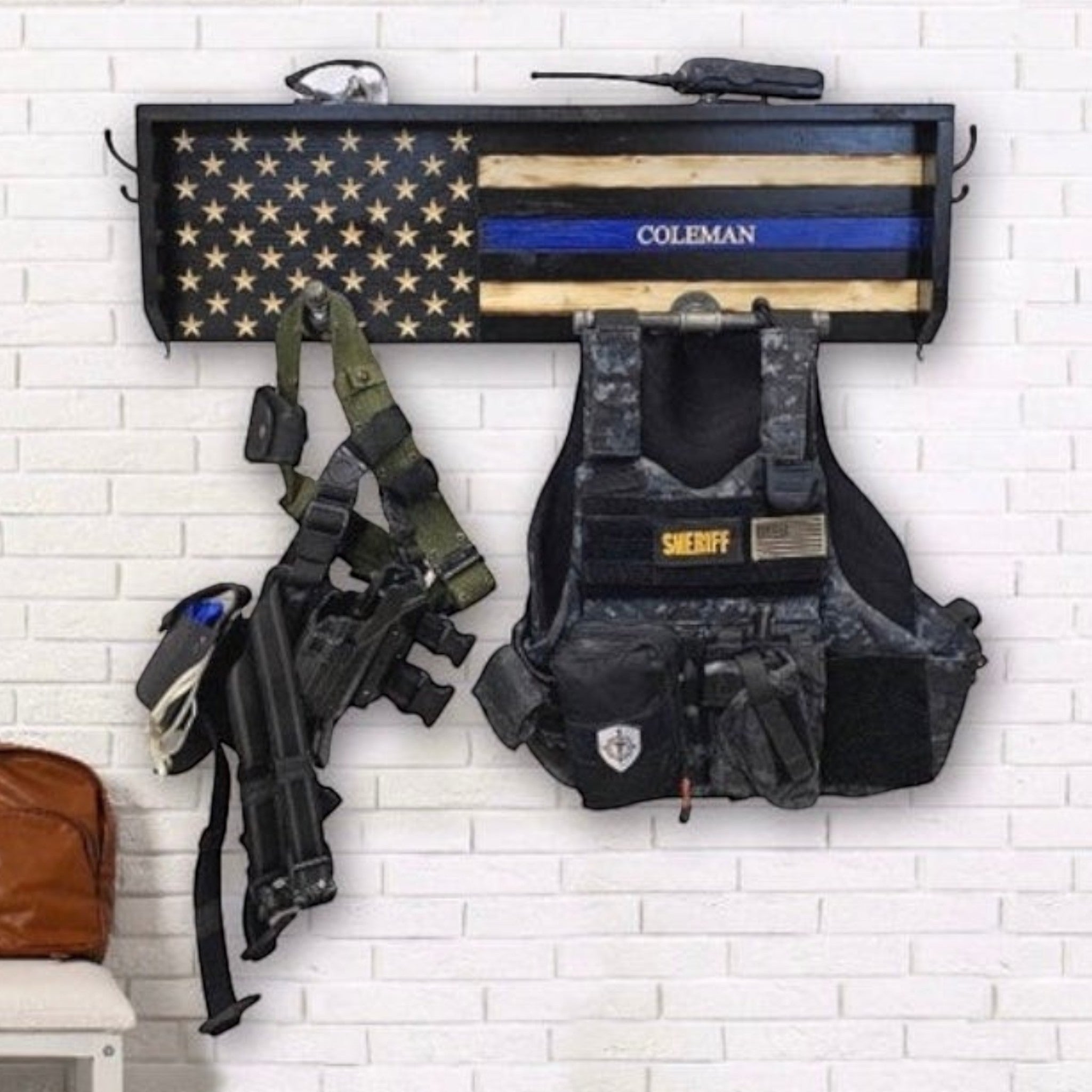Breacher Rustics thin blue line flag gear rack with duty belt, vest, and radio. Custom name 'Coleman' visible. law enforcement gear rack duty belt vest holder wooden wall organizer police equipment storage entryway