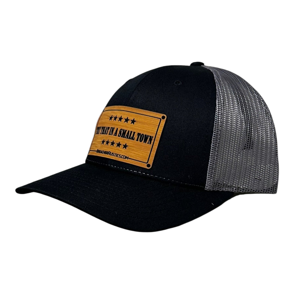 Breacher Rustics black trucker hat with grey mesh back and a bamboo leather patch that says "Try That in a Small Town" Jason Aldean.