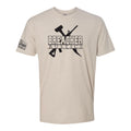 Breacher Rustics tan cotton t-shirt with black graphic logo of crossed hammer and rifle, and American flag detail on sleeve.