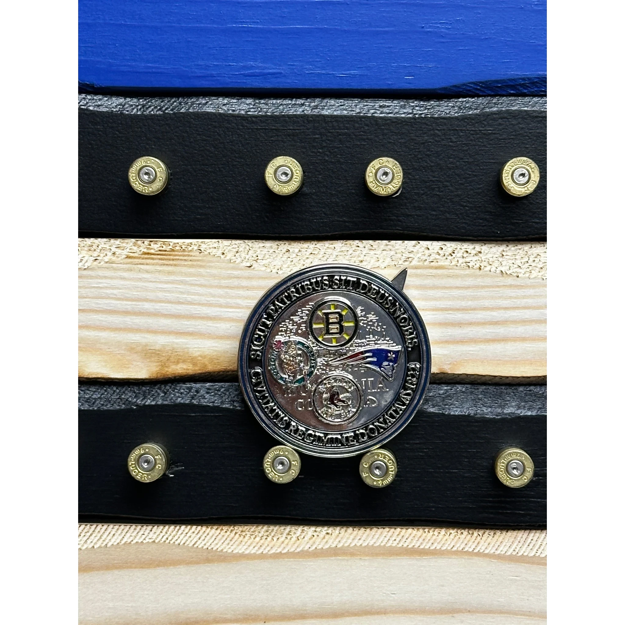 Breacher Rustics Thin Blue Line flag with 9mm casings holding a challenge coin. Wood flag with blue stripe and engraved details.