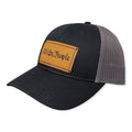 Breacher Rustics black cotton-nylon trucker hat with a bamboo leather patch featuring "We the People" text and a pre-curved visor.