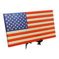 Breacher Rustics wooden American flag with carved stars and stripes, includes black stand. Made in USA.