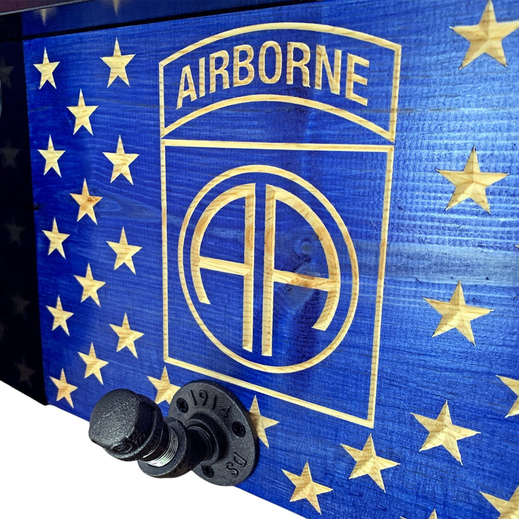 Breacher Rustics blue wooden coat rack with carved Airborne logo and stars, featuring industrial pipe hooks. airborne military flag coat rack wall hooks wooden patriotic entryway organizer army airborne tribute decor usa made veteran military coat rack gear rack