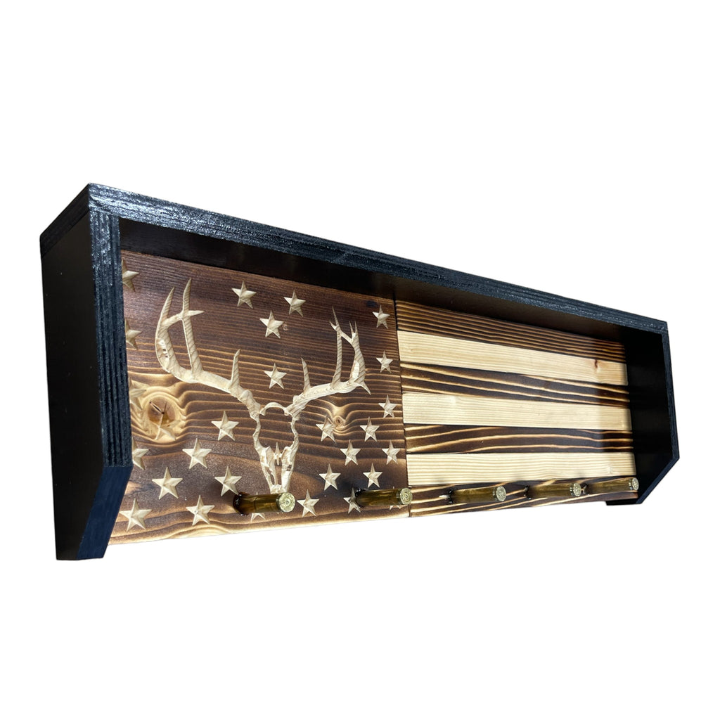 Breacher Rustics wooden key rack with carved deer skull on American flag design, featuring bullet casings as hooks.