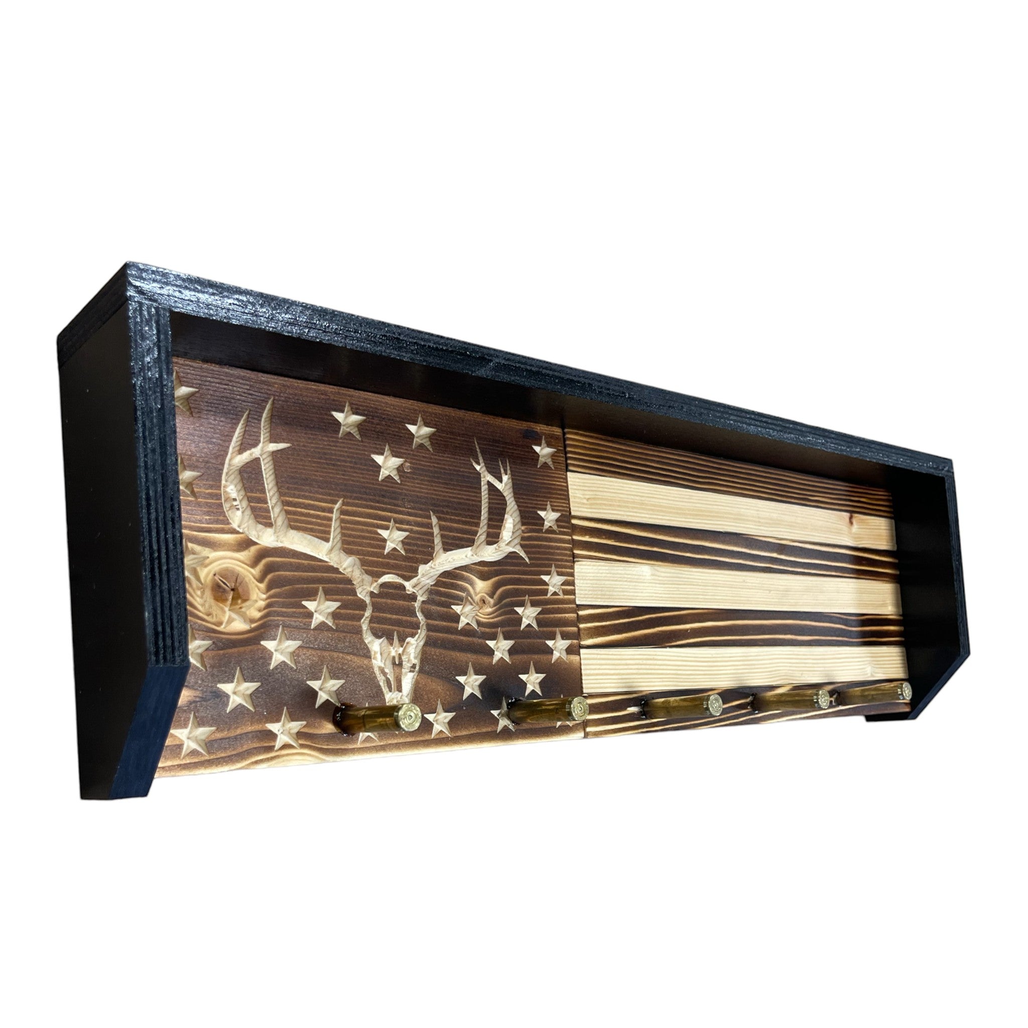 Breacher Rustics wooden key rack with carved deer skull on American flag design, featuring bullet casings as hooks.