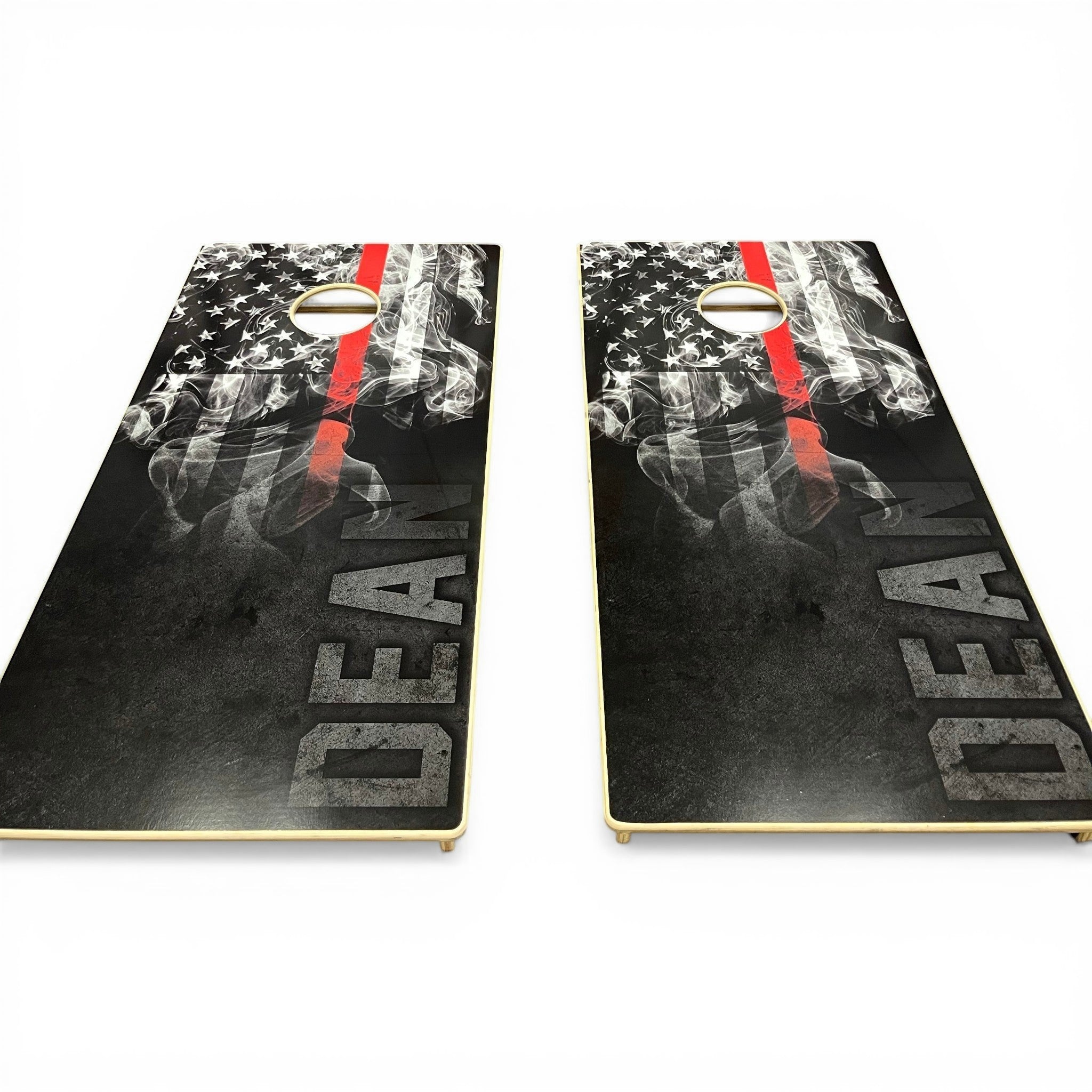 Breacher Rustics Thin Red Line cornhole set featuring a distressed American flag with smoke and the word DEAN. Made from Baltic Birch. firefighter thin red line cornhole set custom wooden game boards patriotic gift for first responders veterans and families