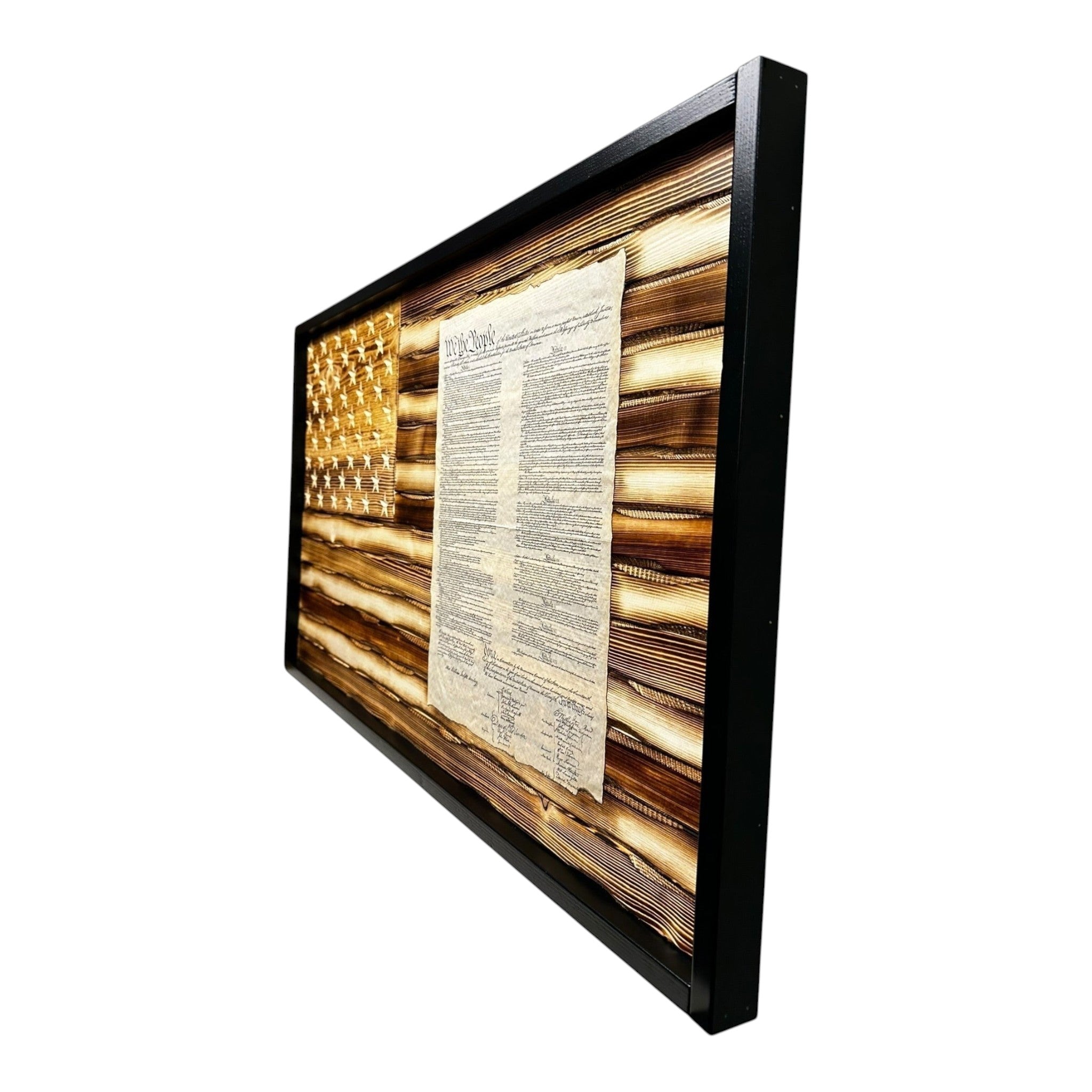Breacher Rustics carved wood US Constitution flag with a battle-worn, burned finish and black frame. Features carved stars and embedded text. rustic battle worn american flag constitution wood wall decor carved patriotic home decoration usa made craftsmanship declaration american history