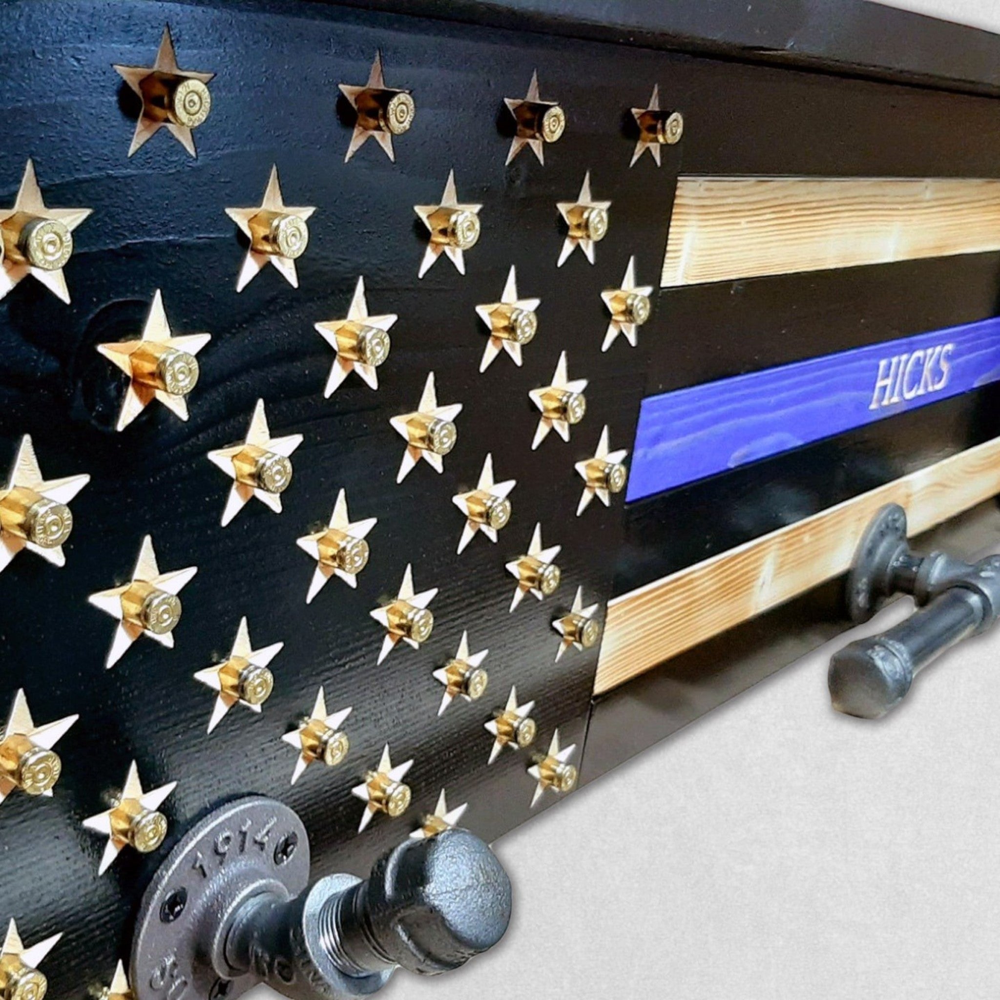 Breacher Rustics Thin Green Line American flag gear rack with brass bullet casing stars and green stripe. Includes pipe hardware. thin green line conservation officer gear rack wooden wall mounted vest and duty belt holder wildlife officer organizer federal agent conservation officer military veteran gear holder rack
